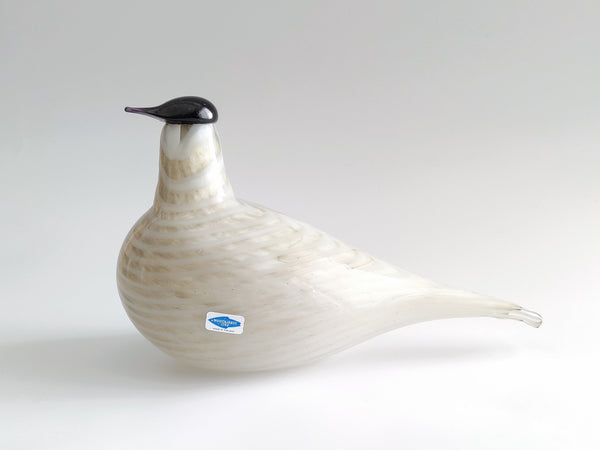 Glass bird sculpture on a white background