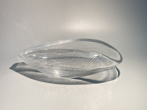 Clear glass bowl on a white background